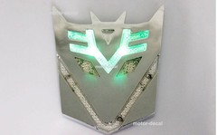 Motor Car Body Solar LED 3D Flash Light Transformers AUTOBOTS DECEPTICONS Emblem
