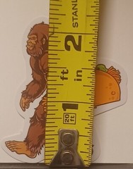 Bigfoot/Sasquatch Cryptid With A Taco Glossy Decal Sticker. 2.25″ Tall×2″ Wide