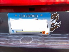 Bigfoot giving finger looking around license plate Die-Cut Sticker